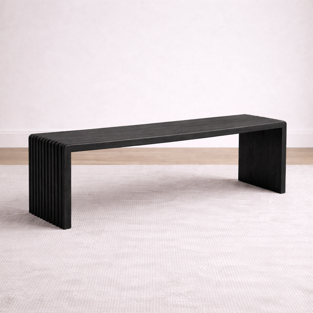 A bespoke bench handcrafted from solid oak with an ebony finish featuring slatted legs built by a custom furniture maker in Nashville, TN.