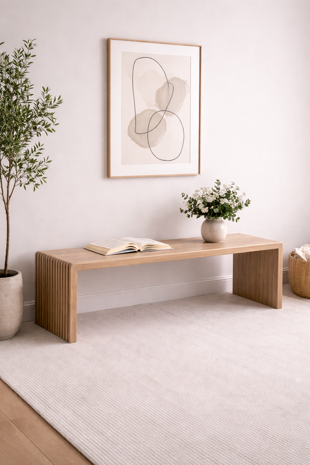 A bespoke bench handcrafted from solid white oak featuring slatted legs built by a custom furniture maker in Nashville, TN.